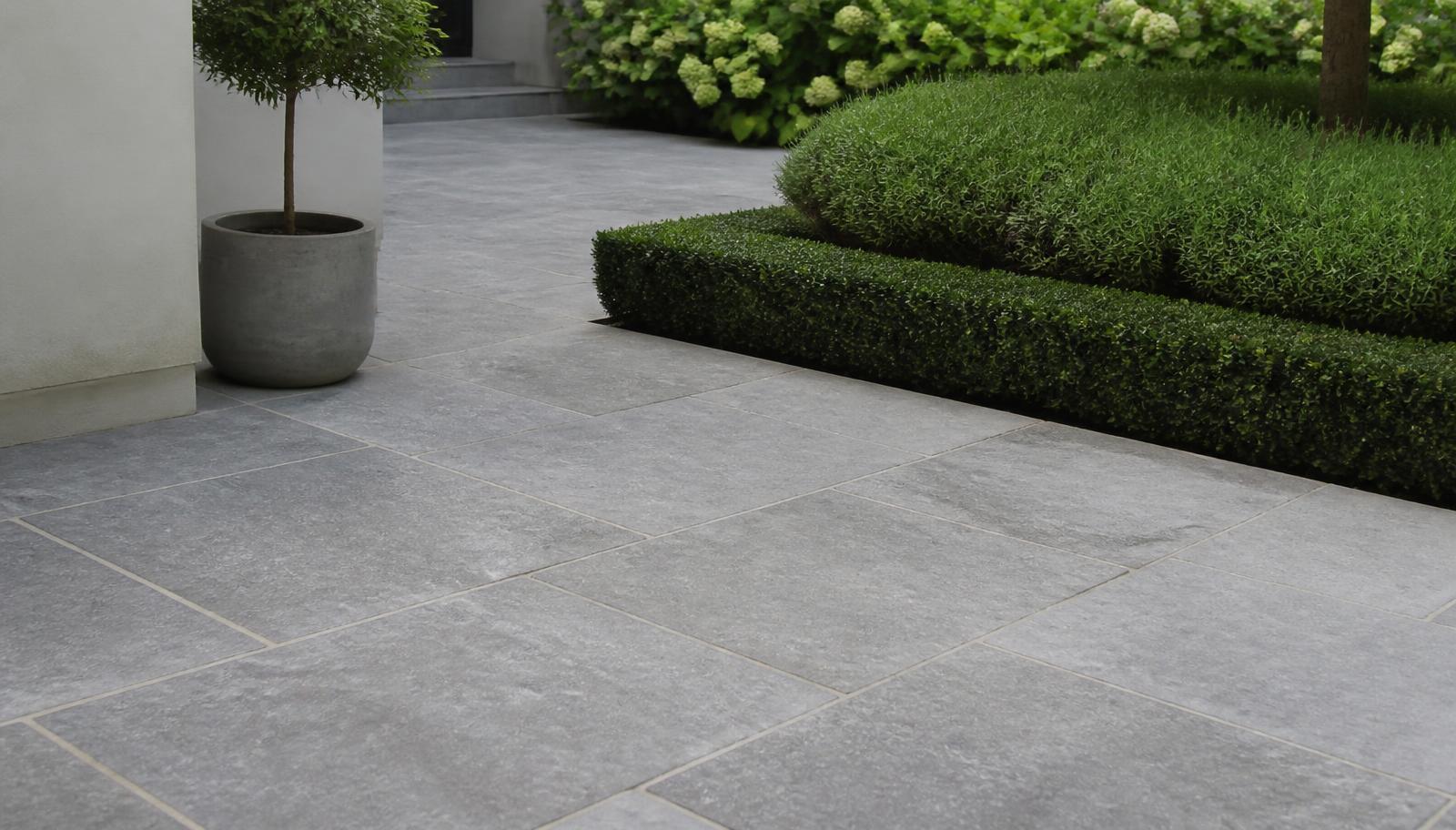 Shahabad Grey limestone paving laid on a contemporary garden terrace with tight joints